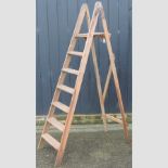 A wooden folding step ladder