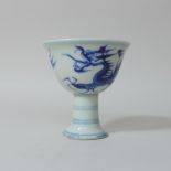 A Chinese porcelain blue and white stem cup, character marks to base,