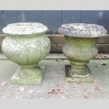 A weathered stone garden urn, 26cm,