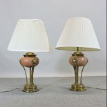 A pair of decorative brass mounted pottery table lamps,