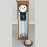 A mid 20th century oak cased master clock, by Synchronone Electric, 140cm tall,