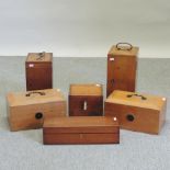 A collection of wooden microscope cases and boxes,