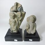 A Tibetan stone carved figure of a deity, on a plinth base, 21cm tall,