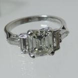 A platinum and diamond engagement ring, main stone approx. 1.