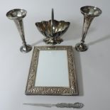 A pair of early 20th century silver spill vases, a plated basket, picture frame and paper knife,