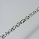 A 9 carat white gold and diamond set bracelet,