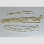 A string of pearls, with a 9 carat gold and emerald set clasp,