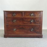 A Victorian mahogany chest of drawers, on a plinth base,