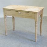 An antique pine side table, with a single drawer,