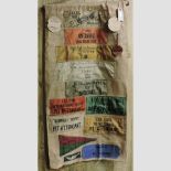 A racing memorabilia sign, with badges and patches from The Road Racing Club, 1935-1938,