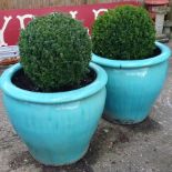 A pair of green glazed garden pots, of large proportions, 65cm tall,