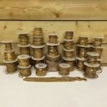 A collection of reels of decorative gilt jeweller's chains