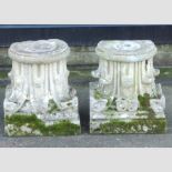 A pair of stone Corinthian capitals,