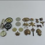 A collection of military badges,