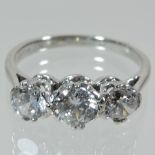 An 18 carat white gold and gem set ring