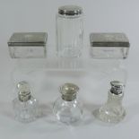 A pair of Victorian silver mounted glass dressing table jars,