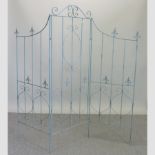 A blue painted metal openwork three-fold garden screen,