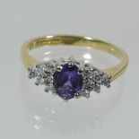 An 18 carat gold amethyst and diamond ring,