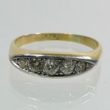 An 18 carat gold five stone boat shape diamond ring,