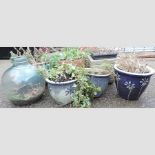 A collection of terracotta and other garden pots,