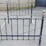 A Victorian style brass and iron double bedstead,