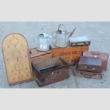 A collection of items to include wooden crates, suitcases,