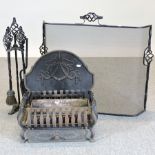 A cast iron fire grate, 47cm, together with a fire back,