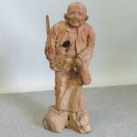A wooden carving of a Chinese man,