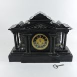 An early 20th century black slate mantel clock,