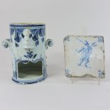 A Delft pottery candle holder, 17cm tall,
