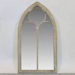 A Gothic style arched outdoor wall mirror,