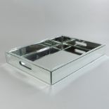 A contemporary mirrored glass tray,