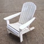 A painted hardwood Adirondack style garden arm chair