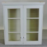 A white painted glazed hanging cabinet,