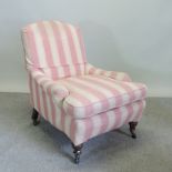 A Victorian Howard style striped upholstered armchair,