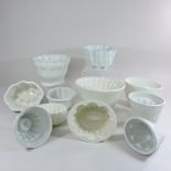 A collection of pottery jelly moulds,