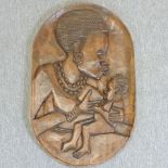 A hardwood plaque, depicting an African lady,