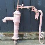A painted metal water pump,