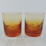 A pair of Moser amber etched glass tumblers, decorated with birds, 10cm tall,