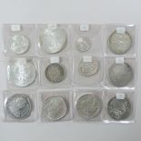 A collection of coins, to include a Charles IV Mexico eight Reales, 1797,