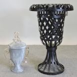 A black painted metal garden urn, 80cm tall,