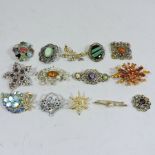 A collection of brooches, to include Scottish Miracle hardstone,