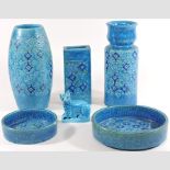 A collection of blue pottery vases and dishes,