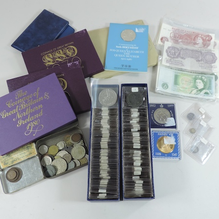 A collection of coins, to include Royal Mint sets, royal commemorative crowns,