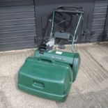 A green Balmoral petrol lawn mower