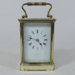 A brass cased carriage clock, cased,