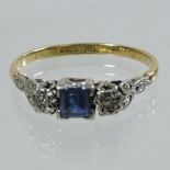 An 18 carat gold platinum sapphire and diamond set ring