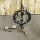 An antique pedal operated cast iron dentist's drill,