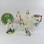 A collection of pottery to include Staffordshire figures, salt glazed figures, majolica,