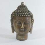 A bronzed head of a Thai buddha,